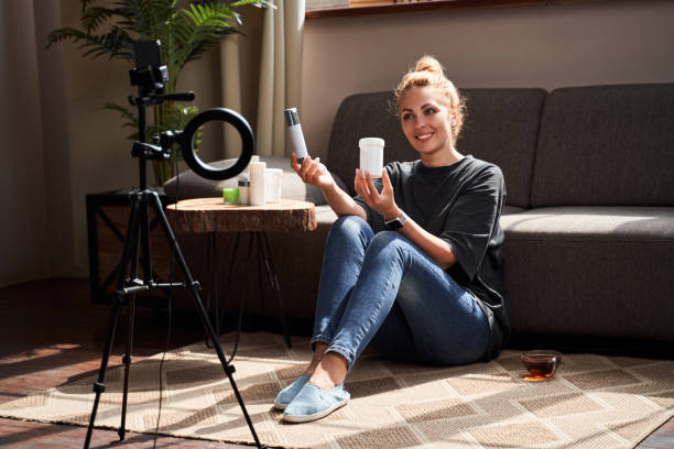 istock Beauty blogger comparing two products on the camera 1264721389