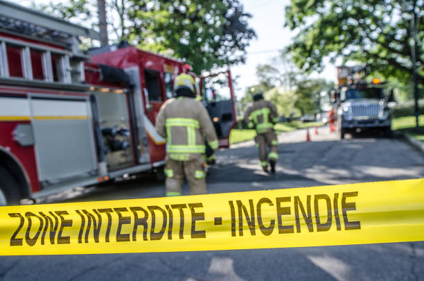 istock Firetruck and firemen with emergency banner 1264721433