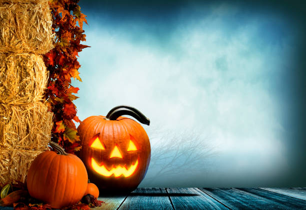istock Jack O'Lantern On Porch Adorned With Autumn Leaves 1264724131