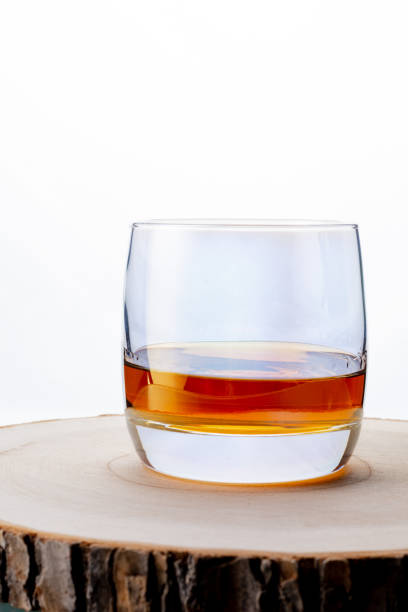 Glass of whiskey on a white background