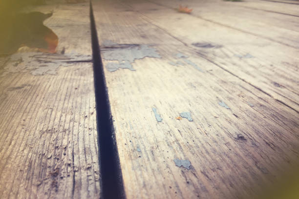 istock Old wooden planks with autumn foliage, copy space background 1264729039