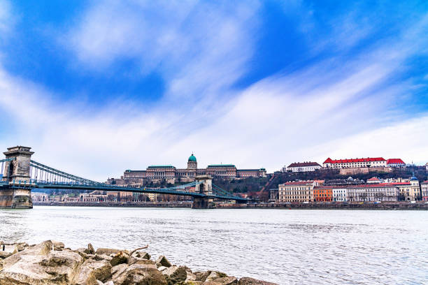 istock Bridge over river against buildings in city 1264732002