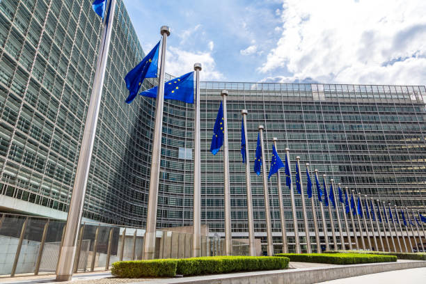 European flags in Brussels European flags in front of headquarters of European commission in Brussels in summer day houses in brussels stock pictures, royalty-free photos & images