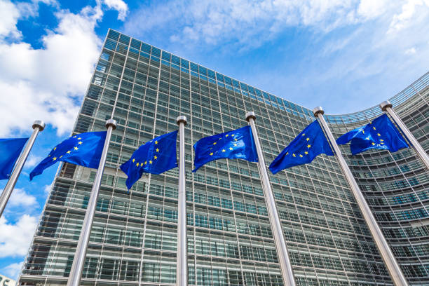 European flags  in Brussels European flags in front of  headquarters of European commission in Brussels in summer day law european community european union flag global communications stock pictures, royalty-free photos & images