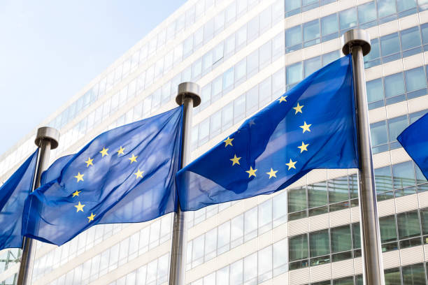 European flags  in Brussels European flags in front of  headquarters of European commission in Brussels in summer day law european community european union flag global communications stock pictures, royalty-free photos & images