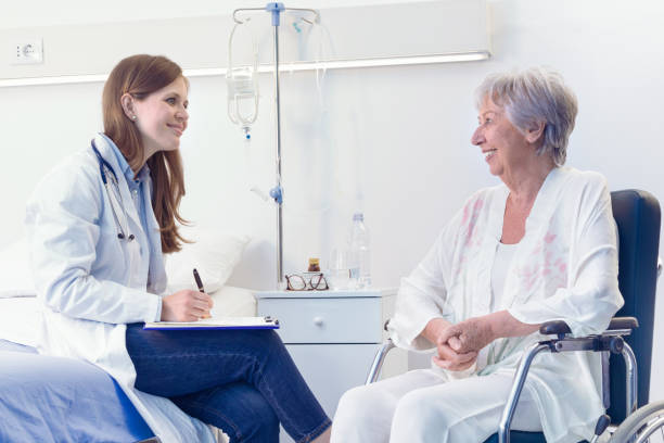 istock Nurse or doctor writing patient notes in a ward 1264736622