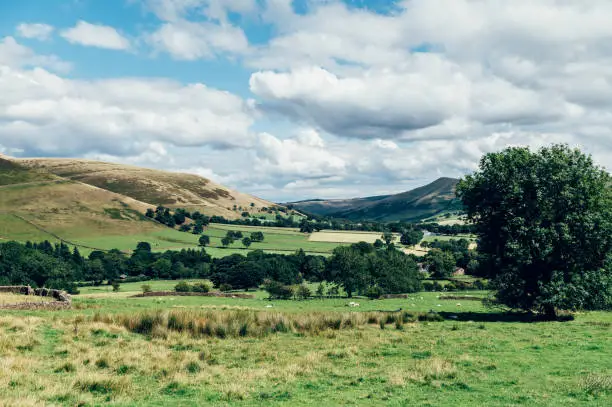 Beautiful field view on Edale village and Mam Tor at Peak District National Park, England, UK. Staycation concept of traveling local