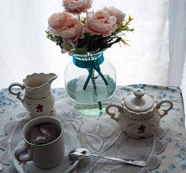 istock Cup of tea and the tea set some flowers 1264736946