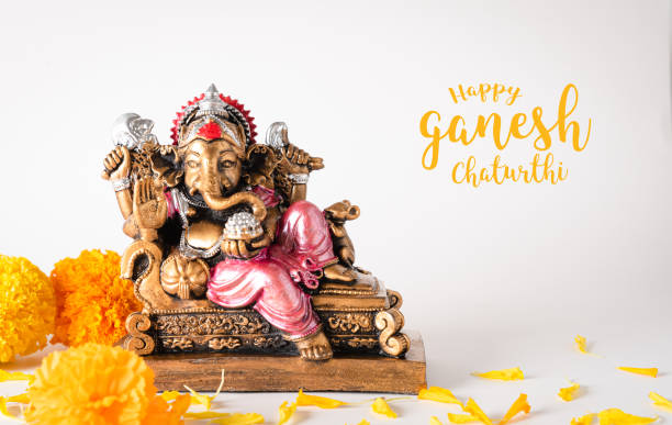 Happy Ganesh Chaturthi festival, Bronze Ganesha statue and Golden texture with flowers, Ganesh is hindu god of Success. Happy Ganesh Chaturthi festival, Bronze Ganesha statue and Golden texture with flowers, Ganesh is hindu god of Success. ganesh chaturthi photos stock pictures, royalty-free photos & images