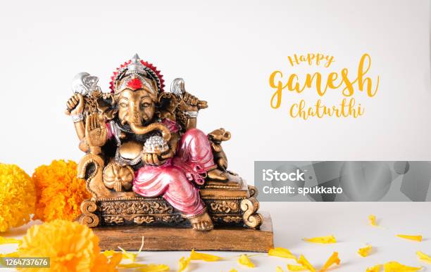 Happy Ganesh Chaturthi Festival Bronze Ganesha Statue And Golden Texture With Flowers Ganesh Is Hindu God Of Success Stock Photo - Download Image Now