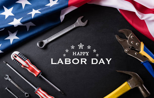 istock Happy Labor day concept. American flag with different construction tools on black table background, with copy space for text. 1264737686