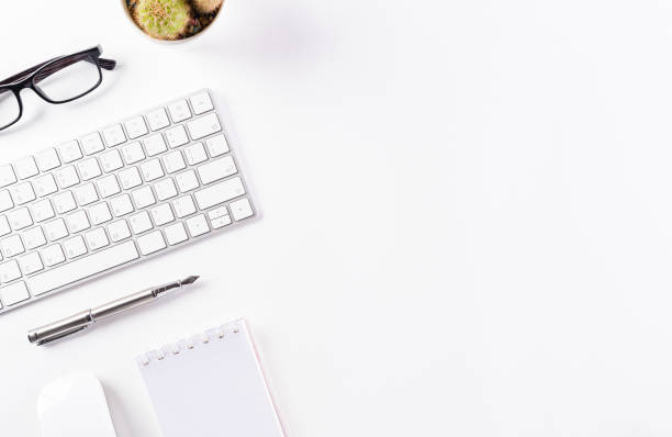 istock Flat lay, top view office table desk. Workspace with keyboard, office supplies and pencil  with copy space on white background. 1264737734