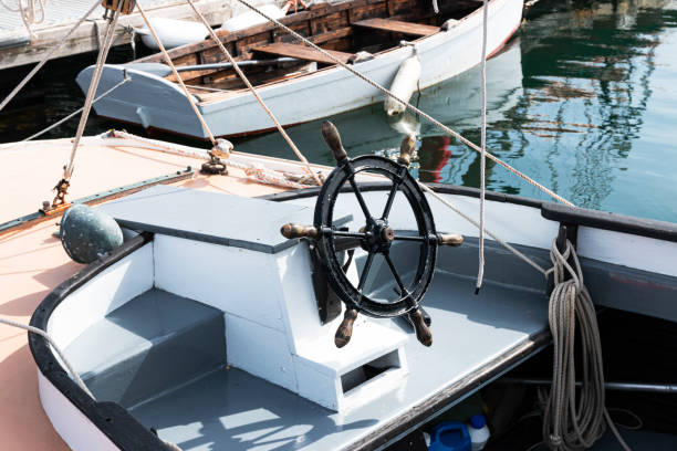 istock Black iron steering wheel on a boat 1264743460