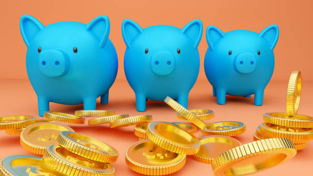 istock Piggy banks and falling coins. 1264751570