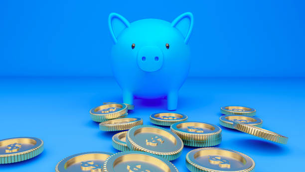 istock A piggy bank and falling coins. 1264751571