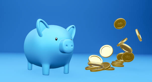 istock A piggy bank and falling coins. 1264751572