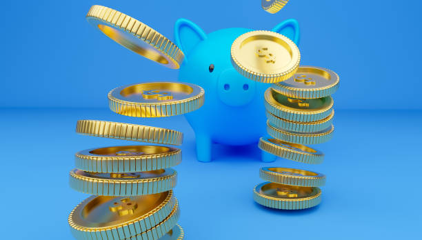 istock A piggy bank and falling coins. 1264753238