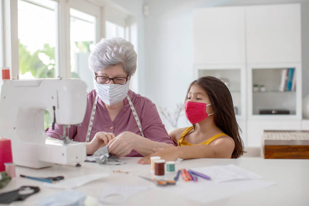 istock Grandma making a fabric mask for covid-19 1264770367