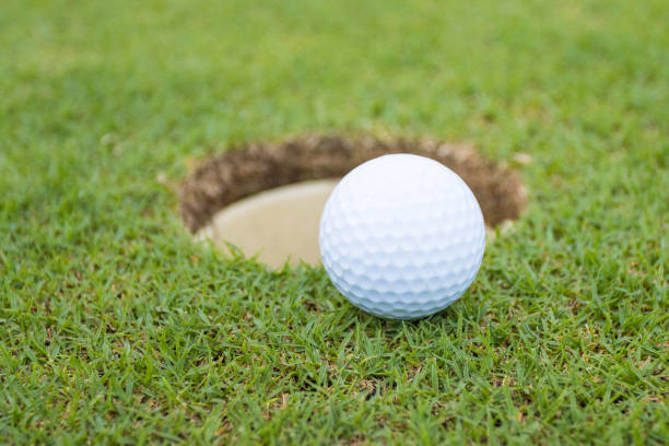istock Golf ball on grass in golf course infront of the green 1264770373