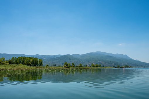Fishing boat on the lake. Blue lake landscape. Iznik, Bursa, Turkey.