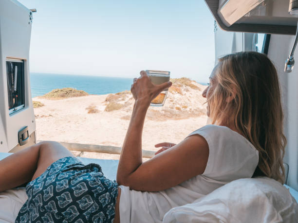 istock Waking up on the edge of a cliff, van life concept 1264784963