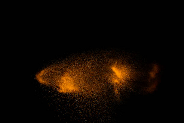 istock Brown colored sand splash.Dry river sand explosion isolated on black background. 1264785596