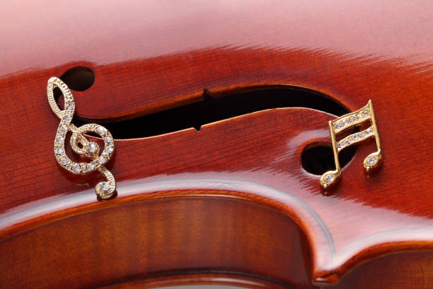 istock Golden brooch on violin 1264787589