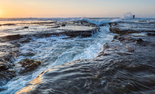istock Sunrise at coastal rock platform - Newcastle Australia 1264794922