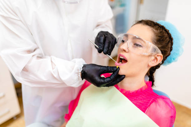 istock Dentist using endodontic needle to collect bacterial colonies on tooth for research 1264795778