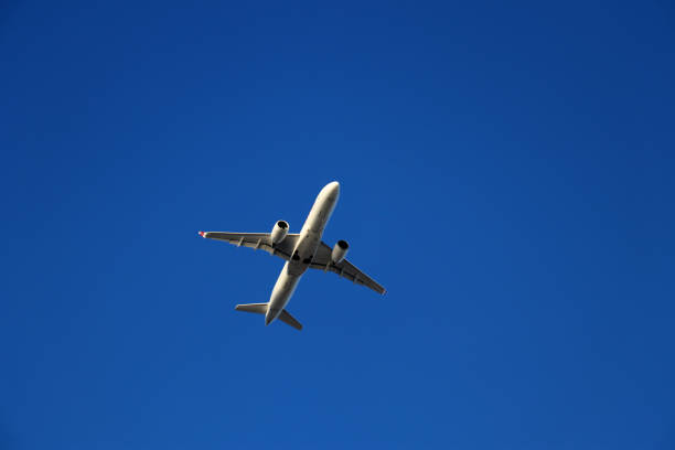 istock Aircraft flying on a clear sky 1264795826