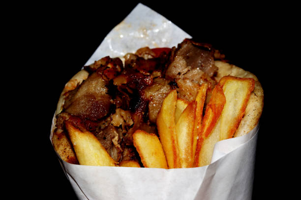 istock Greek Gyros kebab on a black background - close up 1264795975