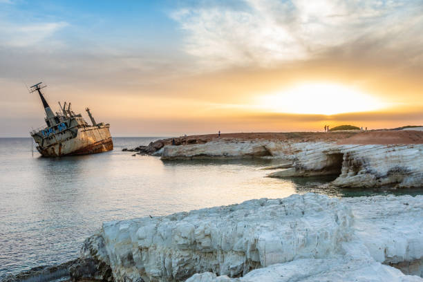 istock Abandoned rusty ship stranded ashore  in the sunset rays at Peyia village, Paphos 1264803223
