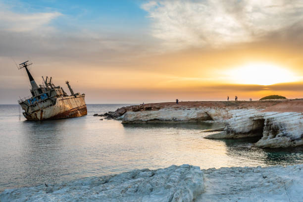 istock Abandoned rusty ship stranded ashore  in the sunset rays at Peyia village, Paphos 1264804148