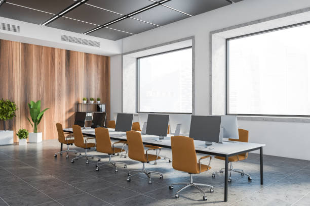 istock White and wooden open space office corner, windows 1264804484