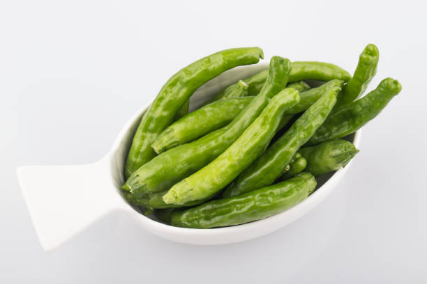 istock Green Organic Shishito Peppers in a bunch. 1264804509