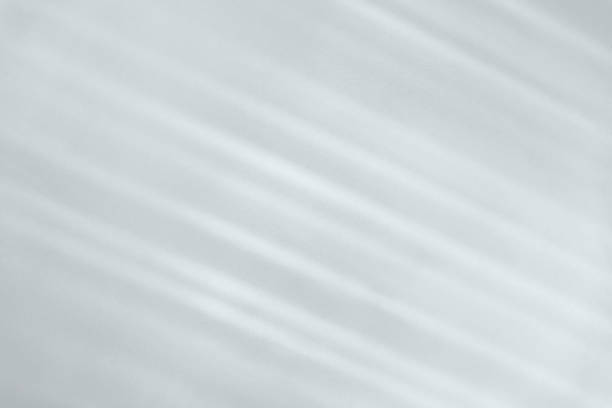 istock diagonal shadow and rays of light on a white background 1264804713