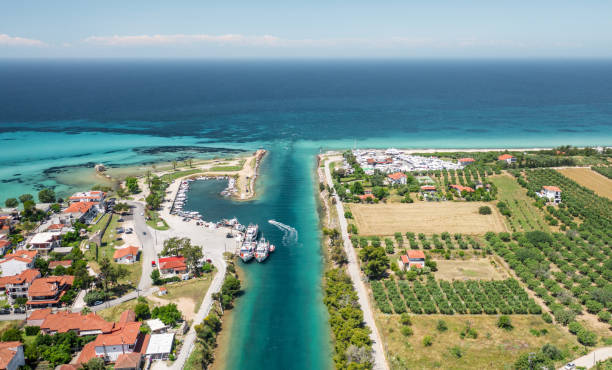 Aerial view at Nea Potidea canal, which connects Toroneos Bay with the Gulf of Thermaikos. Greece, Kassandra, Halkidiki stock photo