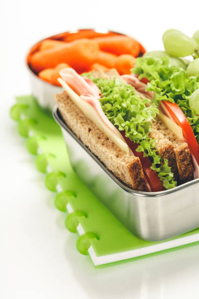 istock Lunch box with sandwich and fruits 1264806465