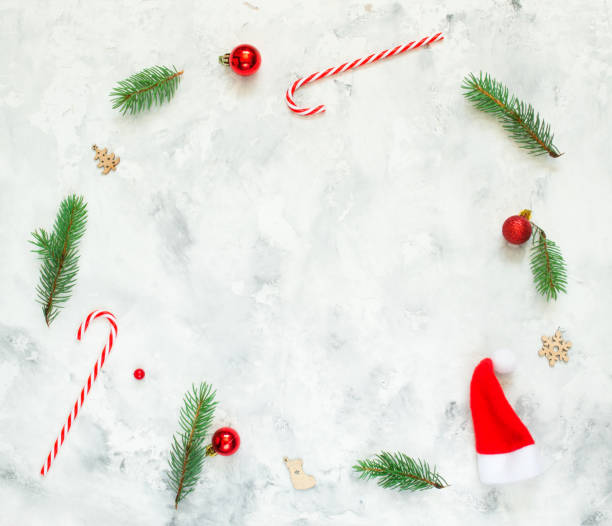 istock Christmas composition. Fir tree branches, red Christmas balls on white concrete background. Christmas, winter, new year concept. Flat lay, top view, copy space. 1264810394