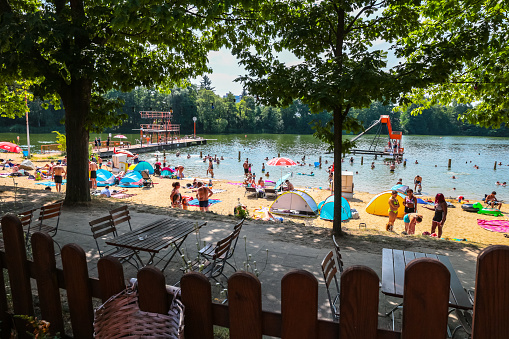 Berlin, Germany - August 7, 2020: Strandbad Lübars lake beach in the Reinickendorf district of Berlin on a hot summer day during coronavirus crisis in Germany.