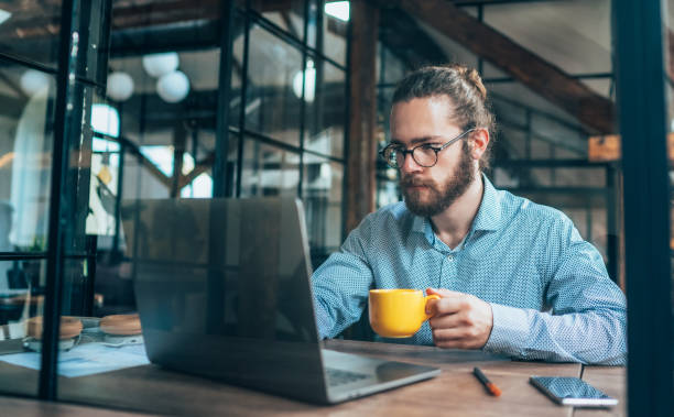 istock Young businessman working at office 1264812288