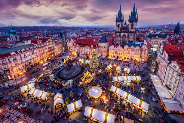 Elevated view of the old town square of Prague, Czech Republic, with the traditional Christmas Market Elevated view of the old town square of Prague, Czech Republic, during winter time with the traditional Christmas Market for the festive season prague christmas market stock pictures, royalty-free photos & images