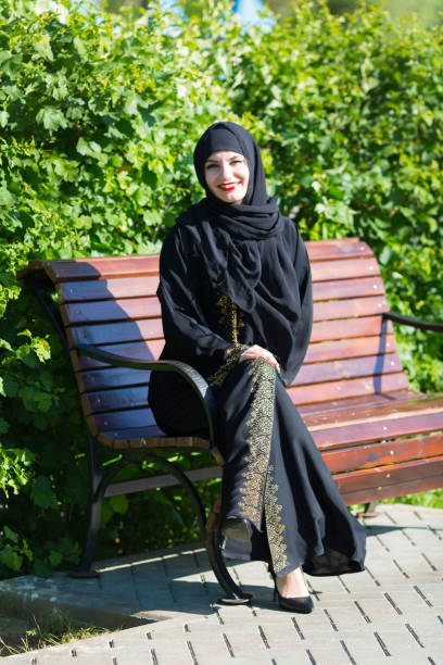 istock Eastern woman with a beautiful smile. Black clothes 1264818773