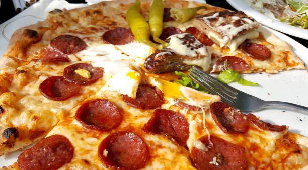 istock Pizza with egg and pepperoni fast food concept 1264819890