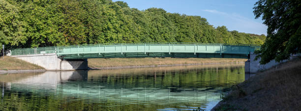 istock green metal bridge at a lake in Cologne, Decksteiner Weiher 1264822130
