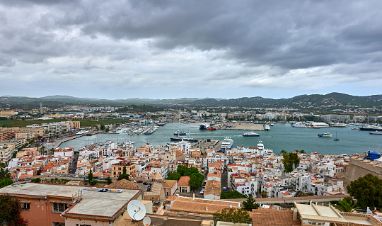 A Panoramic view of the port of ibiza on a cloudy day