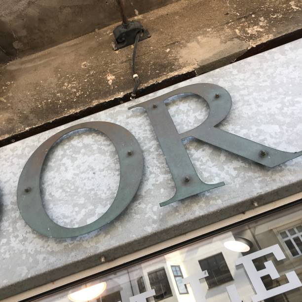 istock Sign over shop window with focus on 'OR' 1264825037