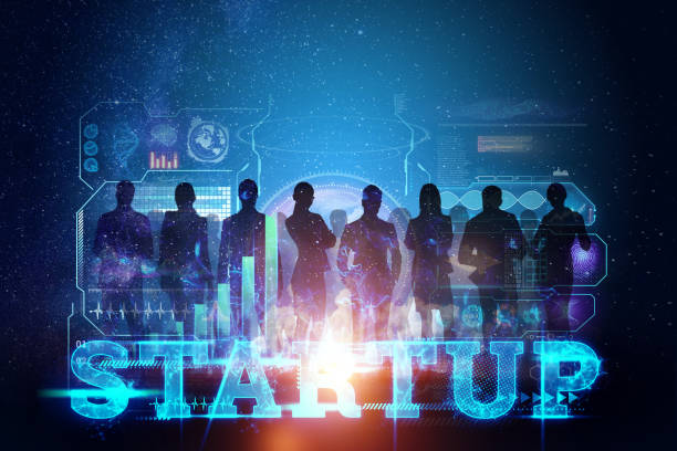 istock The image of team silhouettes on the background of charts, networking, development strategy, business concept, lettering start-up. New technologies. Copy space. 1264826799