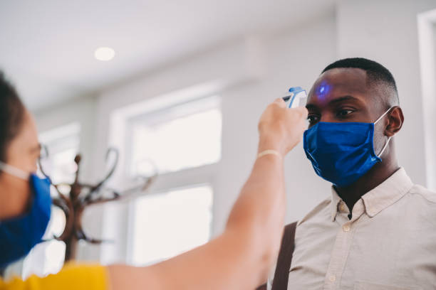 istock Business people measuring temperature in the office 1264828856