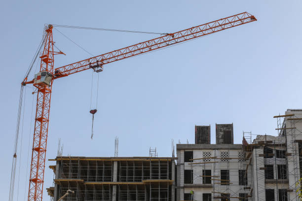 istock Construction site background. Hoisting cranes and new buildings. Industrial background. 1264835584